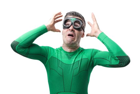 Photo for Terrified funny superhero in green costume with raised hands. - Royalty Free Image