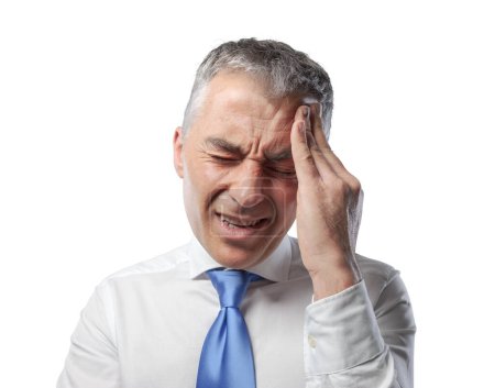 Photo for Stressed corporate businessman having a bad headache, he is tired and exhausted - Royalty Free Image
