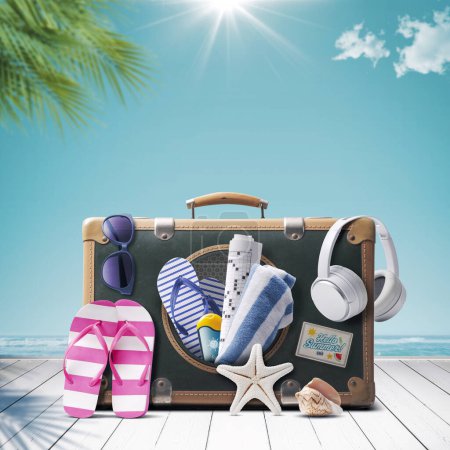 Photo for Vintage style suitcase with assorted beach accessories, summer vacations at the seaside concept, copy space - Royalty Free Image