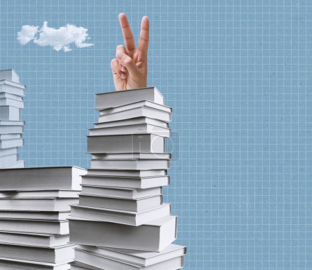 Photo for Student hand doing a V sign and standing on a pile of books, learning and knowledge concept - Royalty Free Image