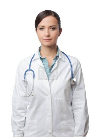 Photo for Confident smiling female doctor posing with lab coat and stethoscope. - Royalty Free Image
