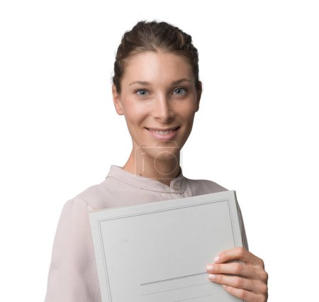 Photo for Professional female businesswoman holding paperwork and smiling at camera - Royalty Free Image