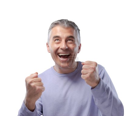 Photo for Cheerful happy mature man celebrating his success with raised fists - Royalty Free Image