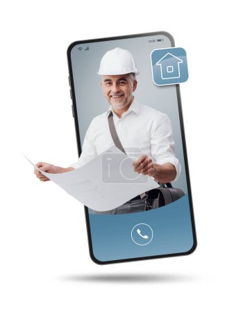 Photo for Architect with safety helmet and project videocalling on smartphone screen, professional service online and consulting - Royalty Free Image