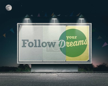 Photo for Inspirational and motivational advertisement on large vintage style billboard: follow your dreams - Royalty Free Image