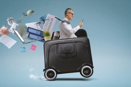 Photo for Businessman riding a fast briefcase with wheels and using smartphone, mobility concept - Royalty Free Image