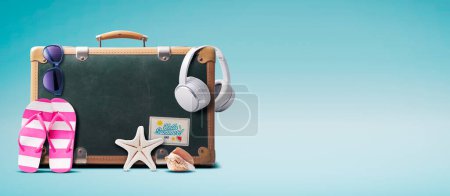 Photo for Vintage suitcase and colorful beach accessories, summer vacations concept, copy space - Royalty Free Image