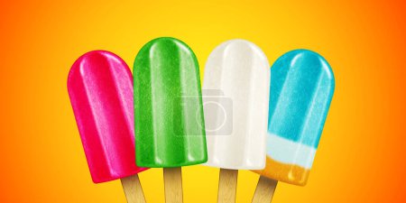 Delicious assorted popsicles on yellow background