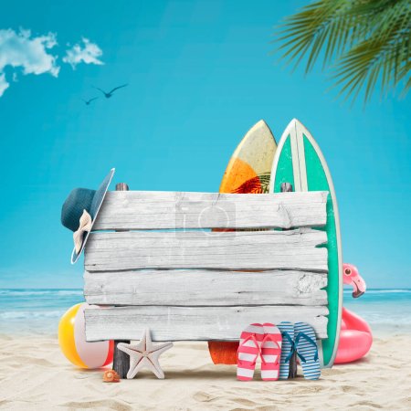 Old wooden sign on the beach, surfboards and beach accessories, summer vacations at the beach concept