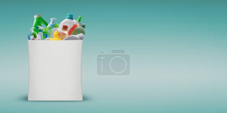 Photo for Assorted household items and detergents in a shopping bag, copy space - Royalty Free Image