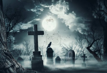 Creepy horror cemetery with old graves and crow, Halloween horror background