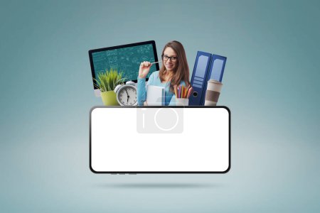 Photo for Happy female student and smartphone with blank screen: e-learning and online courses concept - Royalty Free Image