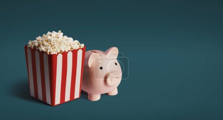 Téléchargez les photos : Popcorn et tirelire : économiser de l'argent sur le concept de divertissement - en image libre de droit