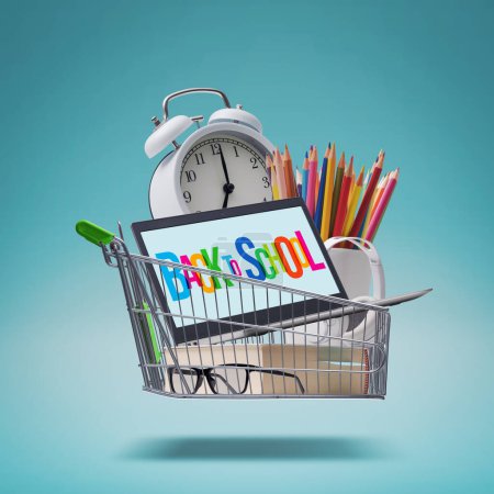 Photo for Shopping cart full of school supplies, back to school shopping concept - Royalty Free Image