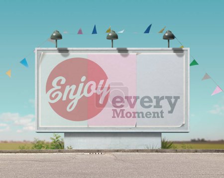 Photo for Inspirational and motivational advertisement on large vintage style billboard: enjoy every moment - Royalty Free Image