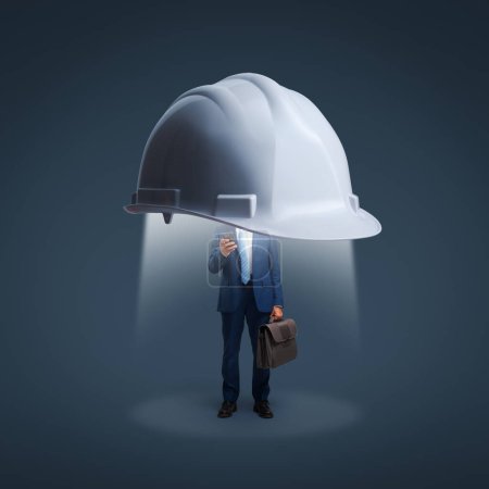 Photo for Big safety helmet protecting a corporate businessman using a smartphone: data protection, security and business - Royalty Free Image