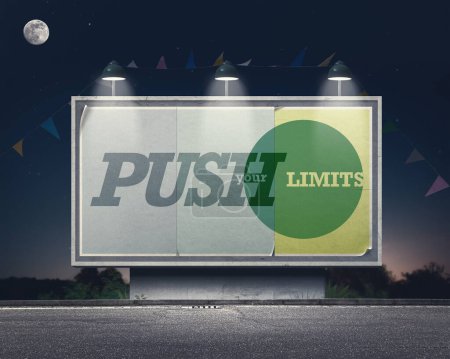 Photo for Inspirational and motivational advertisement on large vintage style billboard: push your limits - Royalty Free Image
