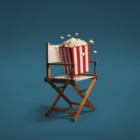 Téléchargez les photos : Chaise de réalisateur et pop-corn frais : concept de cinématographie, de cinéma et de divertissement - en image libre de droit