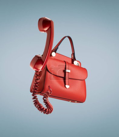 Photo for Red fashion bag with vintage telephone receiver - Royalty Free Image