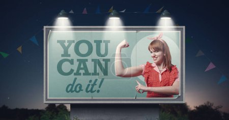 Photo for Motivational empowerment ad with woman showing her bicep: you can do it! - Royalty Free Image