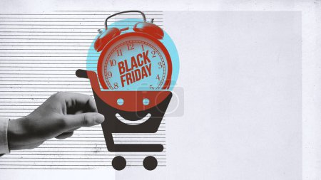 Foto de Cliente sosteniendo un icono del carrito de la compra con despertador en el interior: compras en línea y el concepto de venta Viernes Negro - Imagen libre de derechos