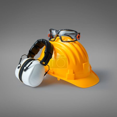Photo for Safety helmet, ear muffs and goggles: personal protective equipment and workplace safety concept - Royalty Free Image