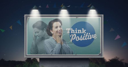 Photo for Happy woman with positive mood on billboard advertisement and motivational quote: think positive - Royalty Free Image