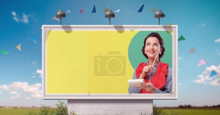 Photo for Vintage style advertisement on billboard: woman smiling and writing a shopping list - Royalty Free Image