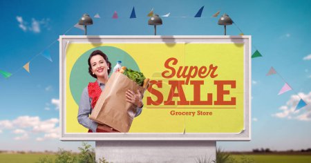Photo for Vintage style grocery shopping advertisement on billboard with happy housewife holding a bag full of groceries - Royalty Free Image