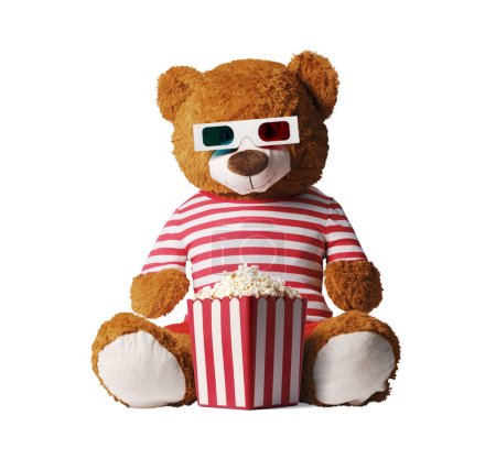 Téléchargez les photos : Mignon ours en peluche regarder des films et manger du pop-corn - en image libre de droit