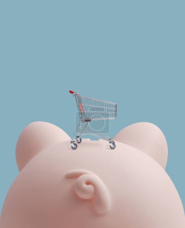 Foto de Pequeño carrito de compras en una enorme alcancía, compras de comestibles y ahorro de dinero concepto - Imagen libre de derechos