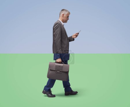 Photo for Creative collage of two cropped images of businessmen: one is checking the phone, the other is walking - Royalty Free Image