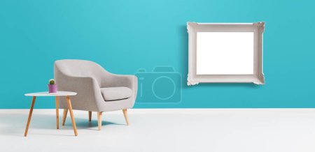 Foto de Interior contemporáneo de la sala de estar con marco blanco en blanco colgando de la pared - Imagen libre de derechos
