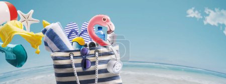 Photo for Bag full of beach accessories at the seaside: travel and summer vacations concept, copy space - Royalty Free Image