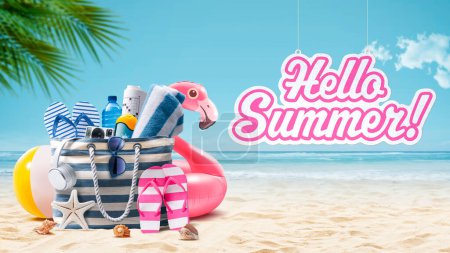 Photo for Beach bag with accessories and cute inflatable flamingo on a tropical beach, hello summer sign hanging, summer vacations and travel concept - Royalty Free Image
