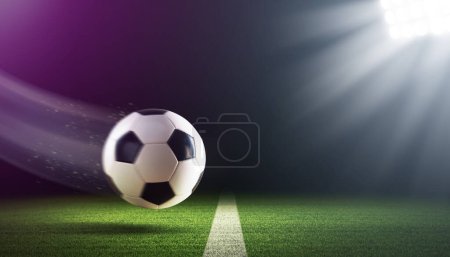 Photo for Fast soccer ball flying under the stadium lights at night, soccer championship concept - Royalty Free Image
