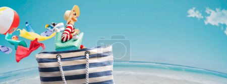Photo for Happy woman travelling inside a beach bag, summer vacations concept - Royalty Free Image