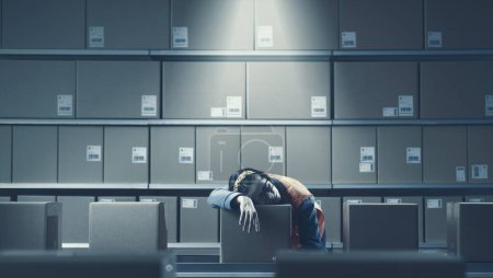 Exhausted female warehouse worker sleeping at work, work burnout concept