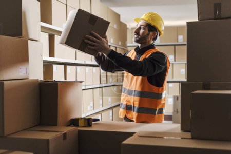 Warehouse clerk stacking cardboard boxes and checking orders: logistics and delivery concept