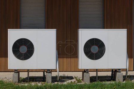 Photo for Modern house showcasing renewable energy with air source heat pumps. - Royalty Free Image