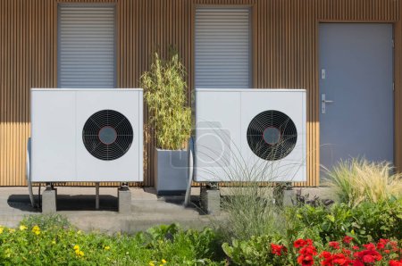 Photo for Eco-Friendly Dual Air Source Heat Pumps at Contemporary Home - Royalty Free Image