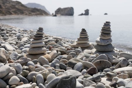 Photo for Stone Cairns with Aphrodite's Rock in Background - Royalty Free Image