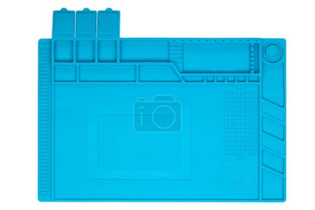 A blue silicone work mat with compartments for tools and components.