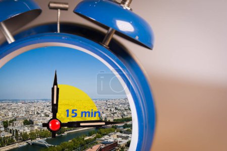 Photo for 15-minute city concept inside a ringing twin bell vintage classic alarm clock. Selective Focus. A 15-minute city is a residential urban concept in which most daily necessities can be accomplished by - Royalty Free Image