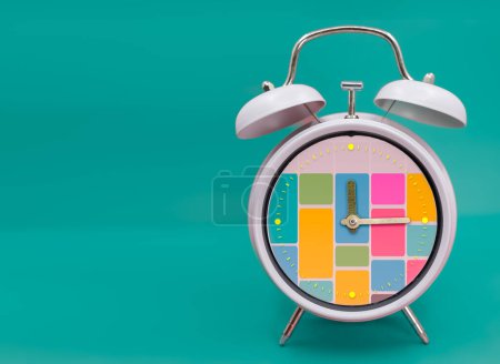 Photo for Time blocking concept inside a ringing twin bell vintage classic alarm clock Isolated on blue. Selective focus. - Royalty Free Image