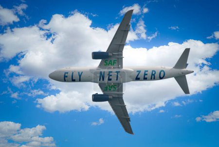 Aircraft soars through the sky with a prominent SAF and Fly Net Zero label on it. Experience the future of carbon-neutral flying and the positive impact of renewable aviation fuel or SAF
