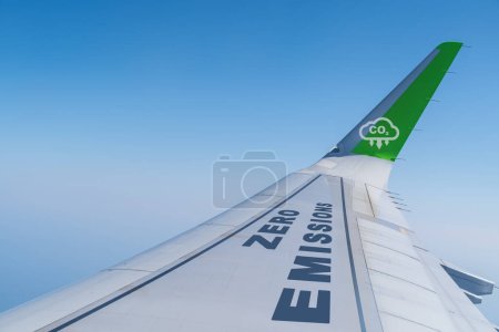 Photo for Commercial aircraft wing with zero emissions and CO2 Reduction Icon . Suitable for concepts as Zero emissions, SAF or Sustainable Aviation Fuel, Circular economy and netCO2 emissions. - Royalty Free Image