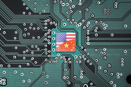 Flag of USA and China on a microprocessor, CPU or GPU microchip on a motherboard. symbolizing war the United States and China tech war. US limits, restricts AI chips sales to China.