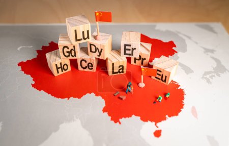 Photo for Rare earth elements over a map of China. China is the dominant global supplier of rare earths, 17 minerals that are indispensable to the manufacturing of smartphones, electric vehicles, military - Royalty Free Image