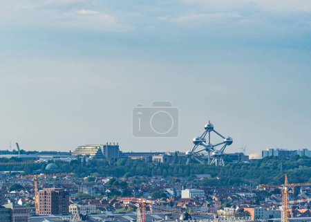 panoramic view of Brussels skyline, featuring the distinctive Atomium structure amidst a blend of modern and historical architecture.